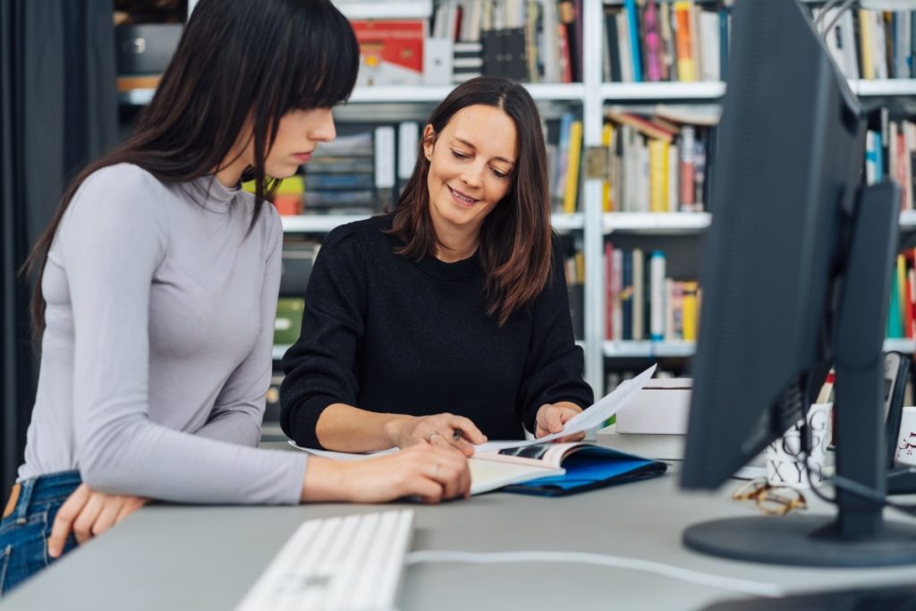 Smiling woman with notebook